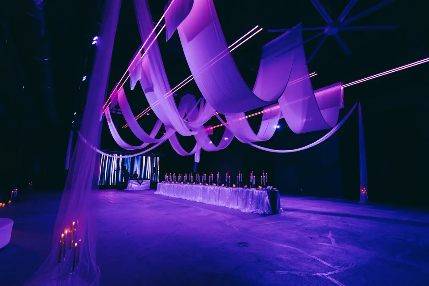 Purple fabric installation over a long table